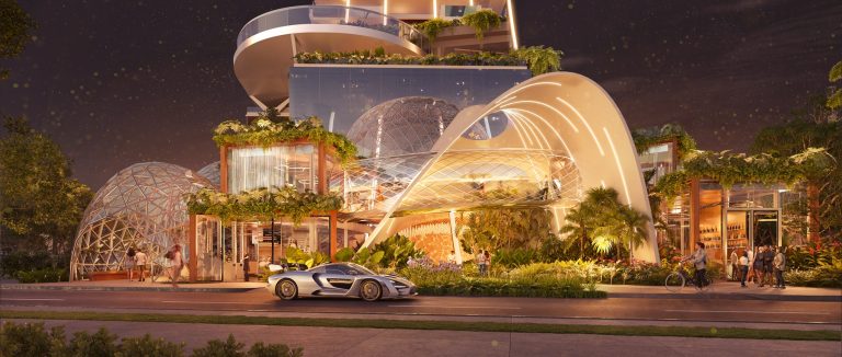Entrada da Senna Tower com detalhes arquitetônicos modernos e cúpulas de vidro iluminadas à noite.